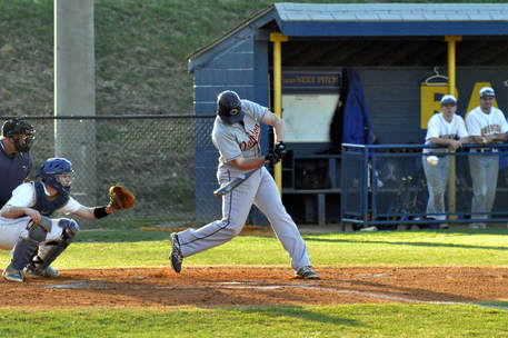 baseball player hitting a ball in a tournament